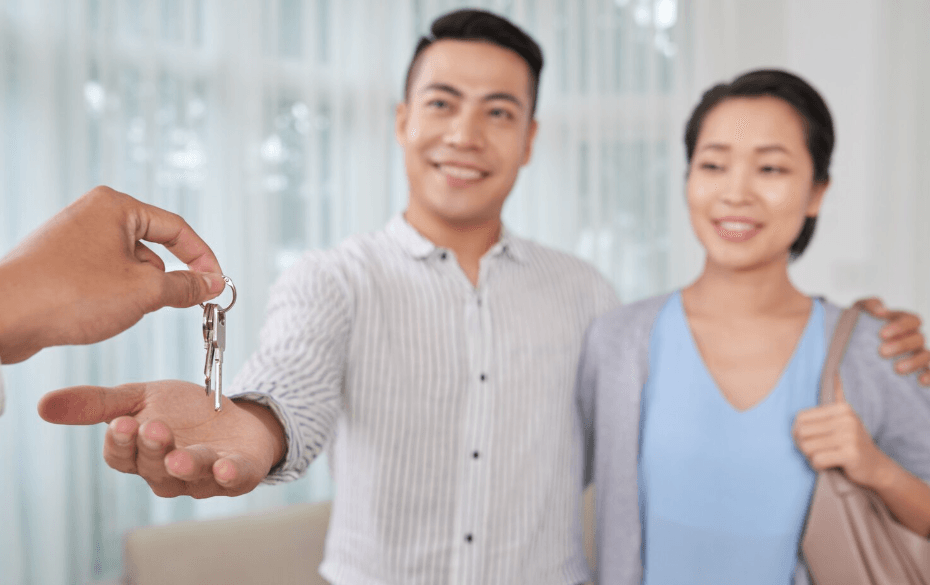 A happy person receiving the keys to their new apartment in Korea, symbolizing a successful and safe housing search.